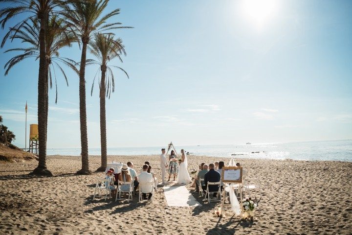 Symbolic beach wedding ceremony on the Costa del Sol near Benalmádena - intimate setup with the sea in the background