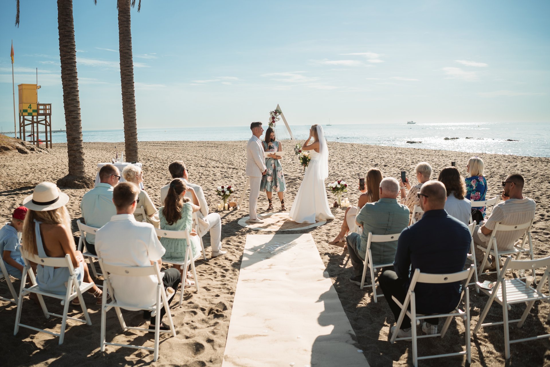 Arthur and Dace during their beach wedding ceremony at sunset in Benalmádena, Costa del Sol