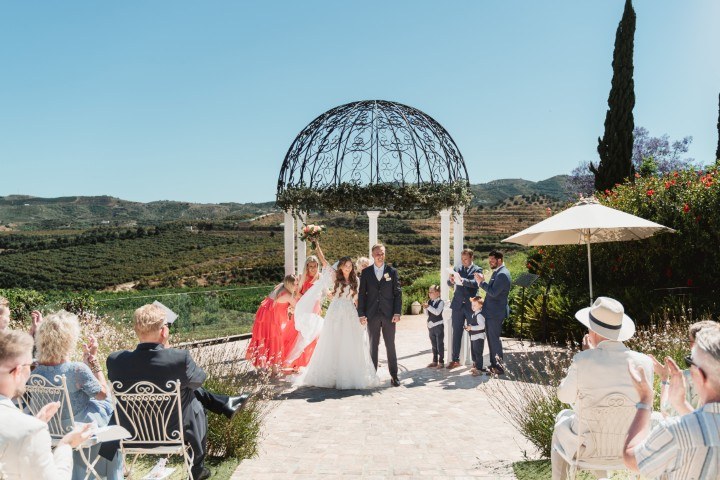 Outdoor wedding ceremony at Cortijo Bravo, Málaga - set amid olive fields with a panoramic Andalusian landscape